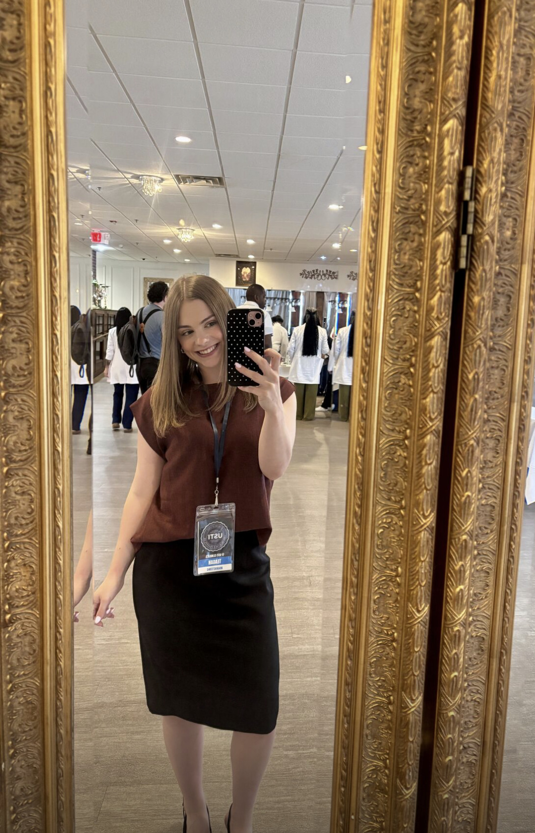 Teagan at USTI Clinicals, wearing her event badge