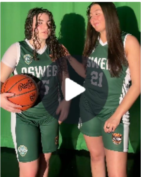 Two players with a basketball, video post